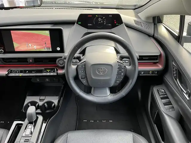 トヨタ プリウス Z 兵庫県 2023(令5)年 1.6万km アティチュードブラックマイカ ・ワンオーナー/・内装：アマチュアレッド/・モデリスタエアロ（NEO ADVANCE STYLE）//フロントスポイラー/サイドスカート//サイドガーニッシュ/リヤスタイリングキット//シグネチャーイルミ/・クールシャインキット//ヘッドライトガーニッシュ//サイドドアガーニッシュ//ドアハンドルガーニッシュ/・メーカーOP デジタルインナーミラー/・メーカーOP ドライブレコーダー前後/・メーカーOP 周辺車両接近時サポート/・メーカーOP ディスプレイオーディオ（コネクティッドナビ対応）Plus/・ディーラーOP HDMI入力端子/・地デジ/BT/USB/Miracast/・パノラミックビューモニター（床下透過式）/・ステアリングリモコン/・合皮シート（D席電動/前席ヒーター/ベンチレーション）/・ステアリングヒーター/・ワイヤレス充電器/・ビルトインETC/・AC100V電源/・パワーバックドア/・純正19インチAW//PCS/LTA/LDA/BSM/PDA/RSA//レーダークルーズコントロール/RCTA/RCD//SEA/PKSB/FCTA/LCA/AHB//Advanced Park/TMN//クリアランスソナー