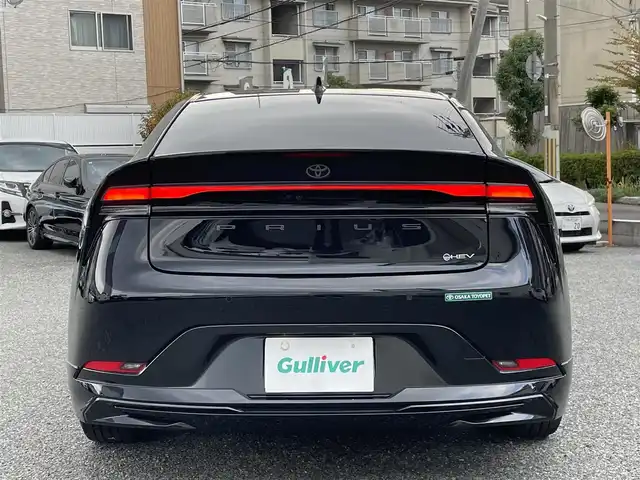 トヨタ プリウス Z 兵庫県 2023(令5)年 1.6万km アティチュードブラックマイカ ・ワンオーナー/・内装：アマチュアレッド/・モデリスタエアロ（NEO ADVANCE STYLE）//フロントスポイラー/サイドスカート//サイドガーニッシュ/リヤスタイリングキット//シグネチャーイルミ/・クールシャインキット//ヘッドライトガーニッシュ//サイドドアガーニッシュ//ドアハンドルガーニッシュ/・メーカーOP デジタルインナーミラー/・メーカーOP ドライブレコーダー前後/・メーカーOP 周辺車両接近時サポート/・メーカーOP ディスプレイオーディオ（コネクティッドナビ対応）Plus/・ディーラーOP HDMI入力端子/・地デジ/BT/USB/Miracast/・パノラミックビューモニター（床下透過式）/・ステアリングリモコン/・合皮シート（D席電動/前席ヒーター/ベンチレーション）/・ステアリングヒーター/・ワイヤレス充電器/・ビルトインETC/・AC100V電源/・パワーバックドア/・純正19インチAW//PCS/LTA/LDA/BSM/PDA/RSA//レーダークルーズコントロール/RCTA/RCD//SEA/PKSB/FCTA/LCA/AHB//Advanced Park/TMN//クリアランスソナー
