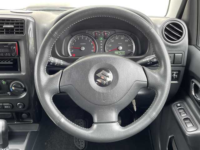 スズキ ジムニー クロスアドベンチャー XC 茨城県 2011(平23)年 5.3万km ブルーイッシュブラックパール3 Bluetooth接続/4WD/シートヒーター/USB入力端子/オートライト/純正フロアマット/純正AW/リモコンキー/エアバッグ/ABS/保証書/取扱説明書