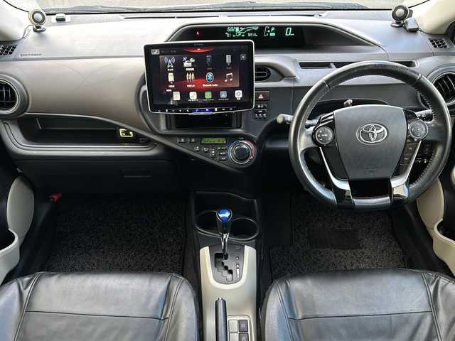 トヨタ アクア G 道東・釧路十勝 2012(平24)年 7.1万km ライムホワイトパールクリスタルシャイン ・社外液晶オーディオ/(BT.FM/AM)/・バックカメラ/・ETC/・スマートキー/・プッシュスタート/・前席シートヒーター/・社外エンジンスターター/・本革巻きステアリング/・オートエアコン/・電格ミラー/・純正フロアマット/・ドアバイザー/・LEDヘッドライト/・コーナーセンサー