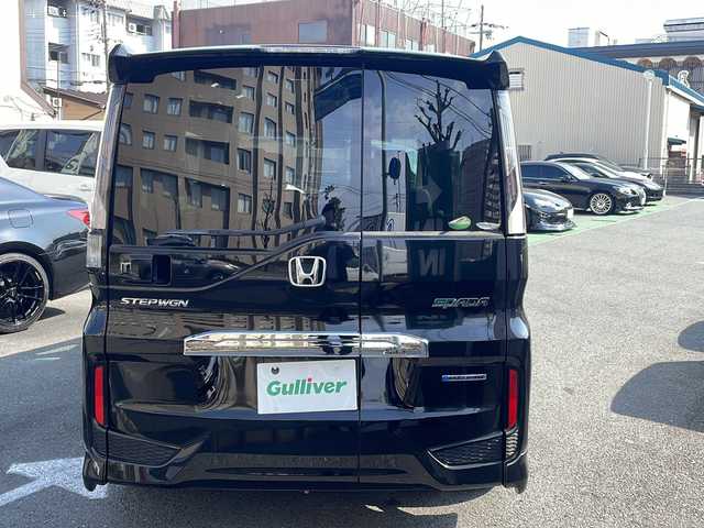 ホンダ ステップワゴン スパーダ ハイブリッドG EX HセンシングBスタイ 京都府 2019(令1)年 8.2万km プレミアムスパークルブラックパール 無限エアロ /10型ナビ/　VXU-197SWi/ バックカメラ /BT /両側パワースライドドア /シートヒーター /ETC /ホンダセンシング /ACC /オートホールド /スマートキー２個 /LEDライト /オートライト/登録時走行距離：81359km/メーカー純正10型ナビ/　CD DVD BT フルセグTV/両側パワースライドドア/衝突被害軽減装置/レーンキープアシスト/レーダークルーズコントロール/LEDオートヘッドライト/フォグランプ/ハーフレザーシート/シートヒーター/ビルトインETC/オートホールド機能付き電子パーキングブレーキ/ロールサンシェード/プッシュスタート/スマートキー/スペアキー