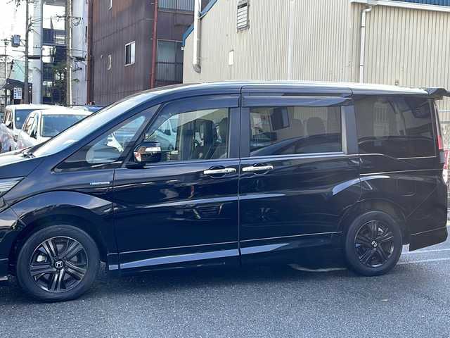ホンダ ステップワゴン スパーダ ハイブリッドG EX HセンシングBスタイ 京都府 2019(令1)年 8.2万km プレミアムスパークルブラックパール 無限エアロ /10型ナビ/　VXU-197SWi/ バックカメラ /BT /両側パワースライドドア /シートヒーター /ETC /ホンダセンシング /ACC /オートホールド /スマートキー２個 /LEDライト /オートライト/登録時走行距離：81359km/メーカー純正10型ナビ/　CD DVD BT フルセグTV/両側パワースライドドア/衝突被害軽減装置/レーンキープアシスト/レーダークルーズコントロール/LEDオートヘッドライト/フォグランプ/ハーフレザーシート/シートヒーター/ビルトインETC/オートホールド機能付き電子パーキングブレーキ/ロールサンシェード/プッシュスタート/スマートキー/スペアキー