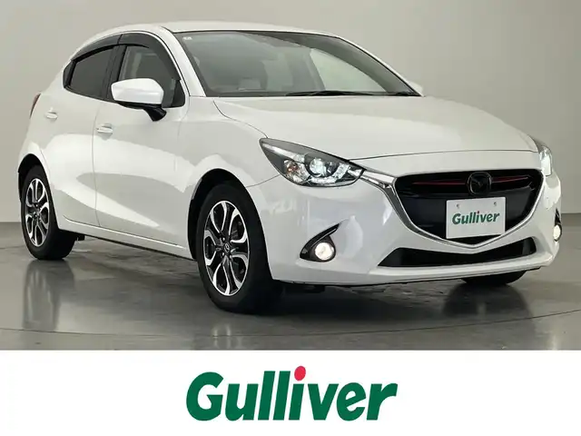 マツダ デミオ XD ツーリング 愛知県 2016(平28)年 8.7万km スノーフレイクホワイトパールマイカ 純正ナビ　シートヒーター　禁煙車　ＨＵＤ　フルセグＴＶ　ＤＶＤ　パドルシフト　USB接続　ドラレコ　ＥＴＣ　衝突軽減　ＬＥＤオートライト　フォグランプ　Bluetooth　クルコン　純正フロアマット　純正１６インチアルミ　プッシュスタート　スマートキー