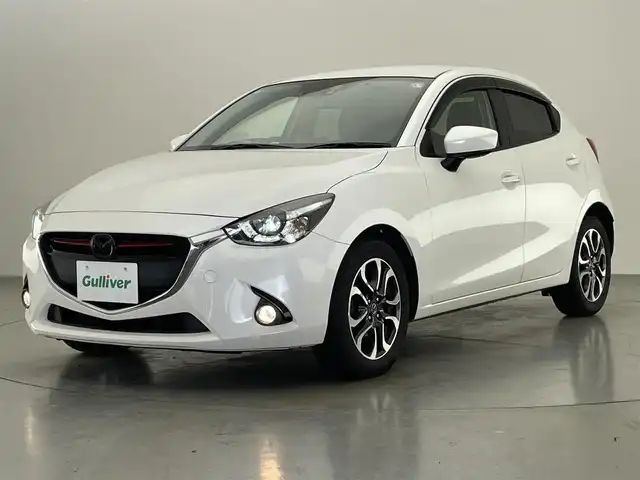 マツダ デミオ XD ツーリング 愛知県 2016(平28)年 8.7万km スノーフレイクホワイトパールマイカ 純正ナビ　シートヒーター　禁煙車　ＨＵＤ　フルセグＴＶ　ＤＶＤ　パドルシフト　USB接続　ドラレコ　ＥＴＣ　衝突軽減　ＬＥＤオートライト　フォグランプ　Bluetooth　クルコン　純正フロアマット　純正１６インチアルミ　プッシュスタート　スマートキー