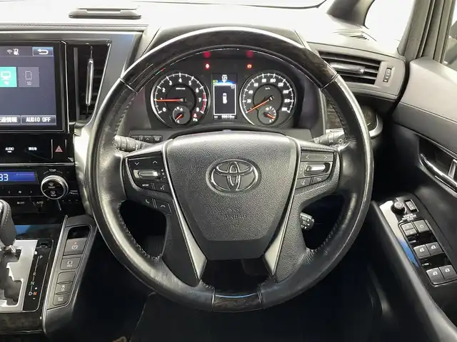 トヨタ アルファード S Aパッケージ タイプブラック 熊本県 2016(平28)年 7万km ホワイトパールクリスタルシャイン ツインムーンルーフ　/純正ナビ（ＣＤ・ＤＶＤ・フルセグ・ＢＴ・ＳＤ）/バックカメラ　/純正フリップダウンモニター　/社外前後ドライブレコーダー　/ビルトインＥＴＣ　/両側パワースライドドア　/前後クリアランスソナー/クルーズコントロール/衝突軽減ブレーキ/横滑り防止/パワーバックドア/ハーフレザーシート/純正フロアマット/純正16インチAW/オートライト/LEDヘッドライト/フォグライト/スマートキー/プッシュスタート/スペアキー1本