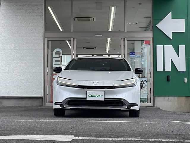 トヨタ プリウス G 愛知県 2023(令5)年 3.6万km プラチナホワイトパールマイカ 禁煙車/純正メーカーナビ/フルセグ/アダプティプクルーズコントロール/ブラインドスポットモニター/デジタルインナーミラー/パノラミックビューモニター/ETC/前後コーナーセンサー/クリアランスソナー/寒冷地仕様/Bluetooth/ステアリングリモコン/オートライト/オートハイビーム/LEDヘッドライト/100V充電/シートヒーター（D/N席）/純正アルミ/純正フロアマット/スペアキー/取説/保証書