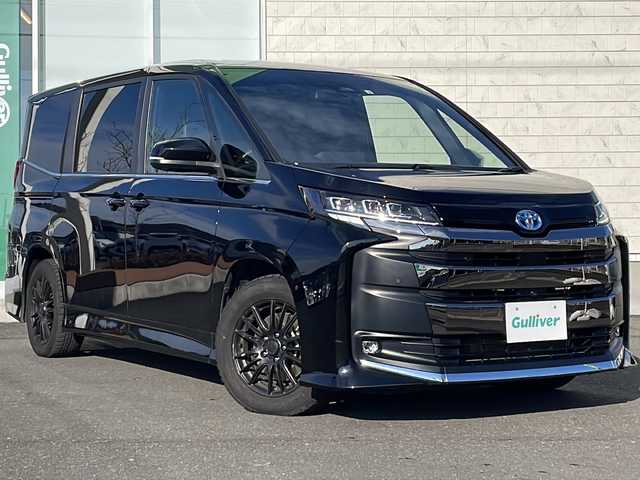 トヨタ ノア ハイブリッド S－Z 岩手県 2022(令4)年 6万km アティチュードブラックマイカ 純正メモリーナビ/AM/FM/Bluetooth/フルセグTV/全方位カメラ/純正フリップダウンモニター/電動リアゲート/ETC/両側パワースライドドア/レーダークルーズコントロール/衝突被害軽減ブレーキ/レーンキープアシスト/アイドリングストップ/シートヒーター/オートライト/オートハイビーム/LEDヘッドライト/フォグランプ/スマートキー/プッシュスタート/電動格納ミラー/社外16インチAW