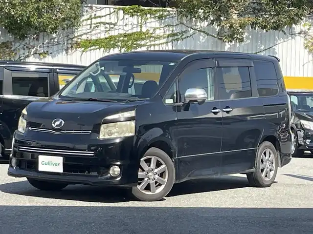 トヨタ ヴォクシー ZS 兵庫県 2010(平22)年 19.4万km ブラック アルパイン製SDナビ(VIE-X08)/・フルセグTV/・バックカメラ/・AM/FM/・CD/DVD/アルパイン製フリップダウンモニター/両側パワースライドドア/ビルトインETC/プッシュスタート/スマートキー/ステアリングリモコン/パドルシフト/電動格納ミラー/AAC