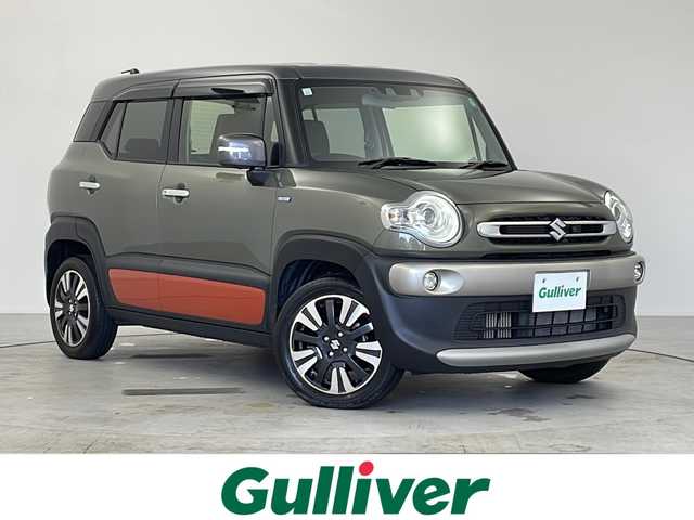 スズキ クロスビー 愛知県 2023(令5)年 1.5万km タフカーキパールメタリック 純正8インチナビ/【Bluetooth/フルセグTV/CD/DVD/USB】/スズキセーフディサポート/・デュアルカメラブレーキサポート/・アダプティブクルーズコントロール（全車速追従機能付）/・誤発進抑制機能/・リヤパーキングセンサー/・全方位モニターカメラ/レーンアシスト/ダウンヒルアシストコントロール/アイドリングストップ/パドルシフト/横滑り防止装置/ハーフレザーシート/シートヒーター（D/N）/ETC/オートエアコン/ステアリングスイッチ/スマートキー/スペアキー/プッシュスタート/純正16インチアルミホイール/純正LEDオートライト/電動格納ミラー/ドアバイザー