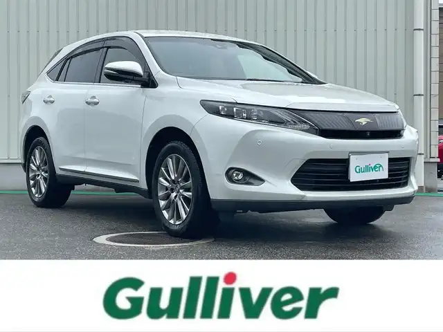 トヨタ ハリアー プレミアム アドバンスドP 富山県 2015(平27)年 7.1万km ホワイトパールクリスタルシャイン 純正8型ナビ(BT/DVD/Blu-ray)/フルセグTV/パワーバックドア/パノラミックビューモニター/ビルトインETC/コムテック前後ドライブレコーダー/レーダークルーズコントロール/インテリジェントクリアランスソナー/ミリ波レーダー方式前方プリクラッシュセーフティ/レーンディパーチャーアラート/オートLEDヘッドランプ/オートマチックハイビーム/木目調/革巻きコンビステアリング/ステアリングスイッチ/合皮/ファブリックコンビシート/運転席パワーシート/JBLプレミアムサウンドシステム/純正18インチアルミホイール/ユーロスピードAWスタッドレス積込/スマートエントリー/スタートシステム/禁煙車