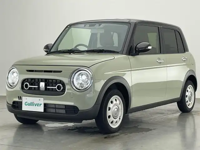 スズキ ラパン ＬＣ X 愛知県 2023(令5)年 0.1万km トラッドカーキメタリック/アーバンブラウン 2トーン デュアルカメラブレーキサポート　禁煙車　ハーフレザー　シートヒーター　ツートンカラー　衝突軽減　車線逸脱　リヤパーキングセンサー　ＬＥＤオートライト　プッシュスタート　ＵＳＢポート　ナノイーＸエアコン