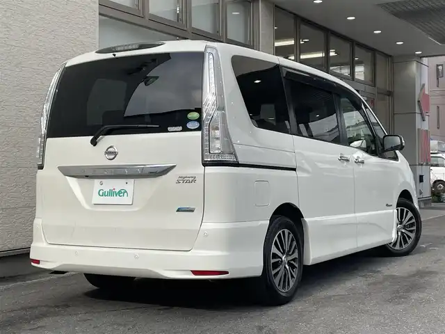 日産 セレナ HWS S HV Vセレ +SeftyⅡ 大阪府 2015(平27)年 11.9万km ブリリアントホワイトパール 純正SDナビ/（フルセグ/BT/CD/DVD）/フリップダウンモニター/バックカメラ/全方位カメラ/両側パワースライドドア/クルーズコントロール/レーンキープアシスト/エマージェンシーブレーキ/アイドリングストップ/横滑り防止システム/前後コーナーセンサー/前後ドライブレコーダー/純正16インチAW/ETC/プッシュスタート/保証書/取扱説明書/スペアキー　有