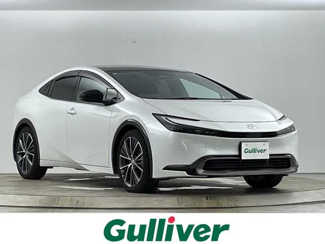 トヨタ プリウス Z 愛知県 2024(令6)年 1.6万km プラチナホワイトパールマイカ ワンオーナー/禁煙車/純正12.3インチナビ/（AM/FM/Bluetooth/フルセグTV/USB)/サンルーフ/AC100V電源/ワイヤレス充電/トヨタセーフティセンス/・プリクラッシュセーフティ/・レーントレーシングアシスト/・レーンディパーチャーアラート/・ロードサインアシスト/・オートマチックハイビーム/・レーダークルーズコントロール/・ブラインドスポットモニター/クリアランスソナー/パーキングアシスト/ETC２．０/ステアリングヒーター/パワーシート/シートヒーター/シートベンチレーション/パワーバックドア/スマートキー/スペアキー有/スペアタイヤ/純正19インチアルミホイール/純正フロアマット/LEDヘッドライト/