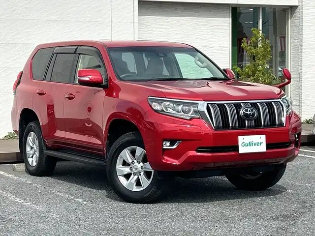 トヨタ ランドクルーザー プラド TX Lパッケージ 千葉県 2017(平29)年 7.8万km レッドマイカメタリック 7人乗 ナビNSZT-W66T バックカメラ ベージュ革 エアシート シートヒーター PCS LDA AHB クルコン 2ndスタート LEDライト オートライト リアスポ サイドステップ 17AW