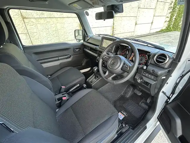 スズキ ジムニー シエラ JC 長崎県 2024(令6)年 1.2万km ピュアホワイトP ワンオーナー/社外ディスプレイオーディオ/（CD/DVD/BT）/バックカメラ/衝突軽減システム/レーンアシスト/シートヒーター/オートライト/前後ドライブレコーダー/スマートキー/プッシュスタート/純正15インチAW