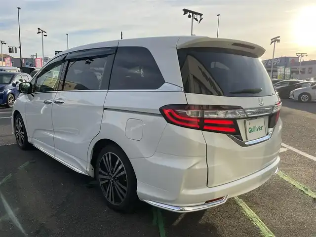 ホンダ オデッセイ アブソルート EX 長崎県 2015(平27)年 9.1万km ホワイトオーキッドパール 純正ナビ/（BT・USB・フルセグ・HDMI・DVD)/後席モニター/ホンダセンシング/レーンキープアシスト/レーダークルーズコントロール/両側パワースライドドア/ハーフレザーシート/運転席パワーシート/バックカメラ/ブラインドスポットモニター/パドルシフト/オートライト/LEDヘッドライト/パドルシフト/ビルトインETC/アイドリングストップ/スペアキー/新車保証書