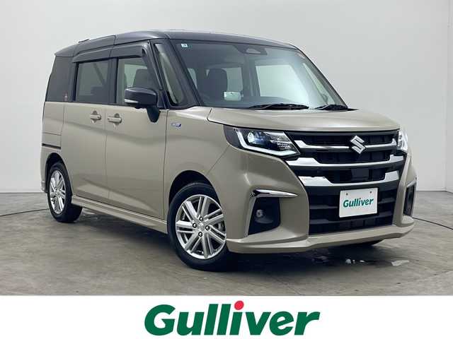 スズキ ソリオ HV MZ 秋田県 2025(令7)年 0.1千km キャラバンアイボリーパールM / ガンメタリック2トーン ４WD/メモリ純正ナビ(Bluetooth/CD/DVD/フルセグ)/全方位カメラ/両側パワースライドドア/前席シートヒーター/前後コーナーセンサー/アイドリングストップ/レーンキープアシスト/クルーズコントロール/車線逸脱警報/クリアランスソナー/オートマチックハイビーム/衝突被害軽減システム/横滑り防止装置/純正AW/サンシュード/LEDヘッドライト/スマートキー/スペアキー