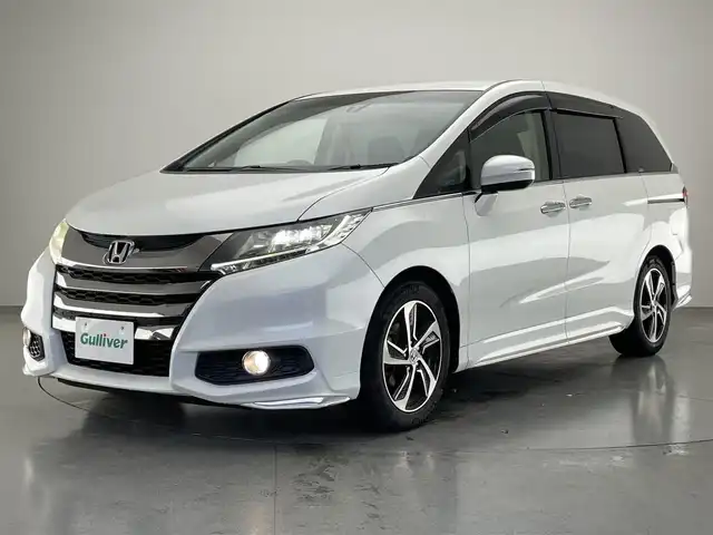 ホンダ オデッセイ アブソルート 愛知県 2013(平25)年 6.4万km ホワイトオーキッドパール 純正ナビ/HDMI/両側パワースライドドア/ETC/パドルシフト/黒ハーフレザーシート/バックカメラ/クルーズコントロール/DVD/LEDオートライト/フォグランプ/純正アルミホイール/カーテンエアバック/純正フロアマット/禁煙車