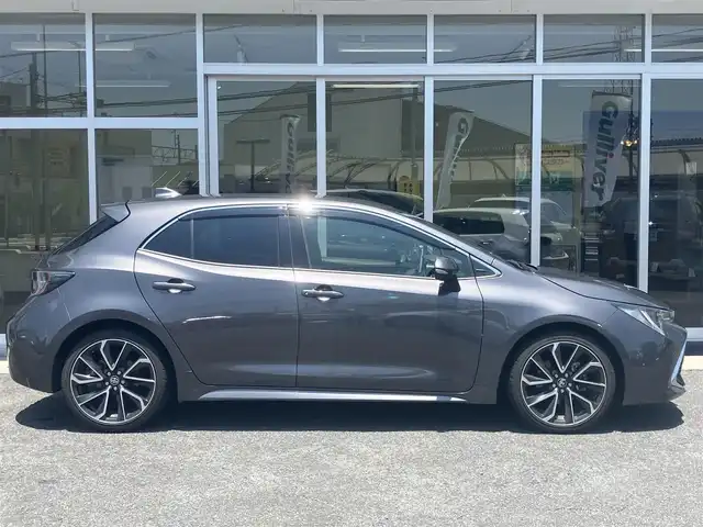 トヨタ カローラ スポーツ ハイブリッドG Z 山口県 2021(令3)年 5.6万km グレーメタリック 純正ディスプレイオーディオ/　＆バックカメラ/純正フロアマット/純正18インチアルミ/純正LEDヘッドライト/純正フォグランプ/フロントシートヒーター/スマートキー/ブラインドスポットモニター/リアクロストラフィックアラート/オートライト/オートハイビーム