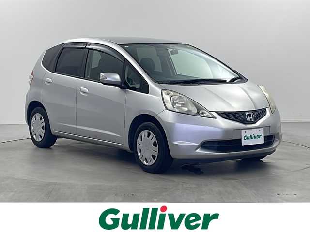 ホンダ フィット G 栃木県 2010(平22)年 6万km アラバスターシルバーメタリック 純正ナビ/・AM/FM/CD/SD/ワンセグ/USB/ETC/前後ドライブレコーダー/純正14インチスチールホイール/社外14インチアルミ付きスタッドレスタイヤ積込み/電動格納ミラー/ドアバイザー/保証書/取扱説明書