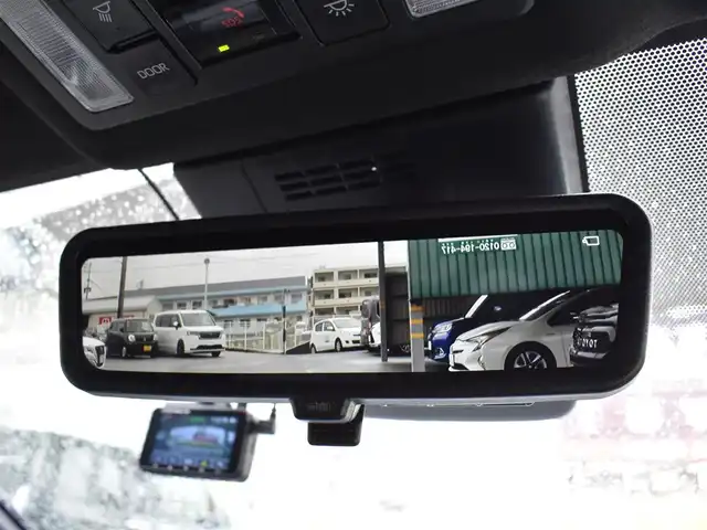 トヨタ ヴォクシー ハイブリッド S－Z 福岡県 2025(令7)年 0.2万km アティチュードブラックマイカ ワンオーナー/トヨタセーフティセンス/快適利便パッケージ(High)/純正OP10.5インチディスプレイオーディオ/フルセグ/CD/DVD/BT/HDMI/パノラミックビューモニター/純正OP13．2型後席ディスプレイ/純正OP3眼LEDヘッドライト/純正OPブラインドスポットモニター/純正OPアドバンストパーク/純正OPパーキングブレーキサポート/純正OPカラーヘッドアップディスプレイ/純正OPデジタルインナーミラー/純正ラグジュアリーフロアマット/純正GRスポーツサイドバイザー/TZ前後ドライブレコーダー/両側パワースライドドア/リア5面スモークフィルム/ビルトインETC2.0/新車時保証書/取扱説明書