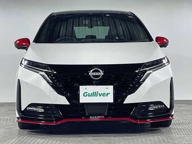 日産 オーラ ニスモ 神奈川県 2022(令4)年 1.4万km ピュアホワイトパール / スーパーブラック 2トーン 純正9インチディスプレイオーディオ/ナビリンク機能　Bluetooth　USB　HDMI　フルセグ　apple car play　android auto/プロパイロット/先行車追従走行/車線中央維持支援/インテリジェントルームミラー/インテリジェントアラウンドビューモニター/ハンドル支援/クリアランスソナー/シートヒーター（D＋N席）/置くだけ充電/ビルトインETC2.0/電動サイドブレーキ/オートホールド/ECOモード/NSMOモード/プッシュスタート/ステアイングスイッチ/革巻きステアリング/シートリフター/純正フロアマット/LEDヘッドライト/オートライト/ブラインドスポットモニター/フォグランプ/電動格納ミラー/ウインカーミラー/SOSコール/純正17インチアルミホイール/インテリジェントキー/スペアキー1本