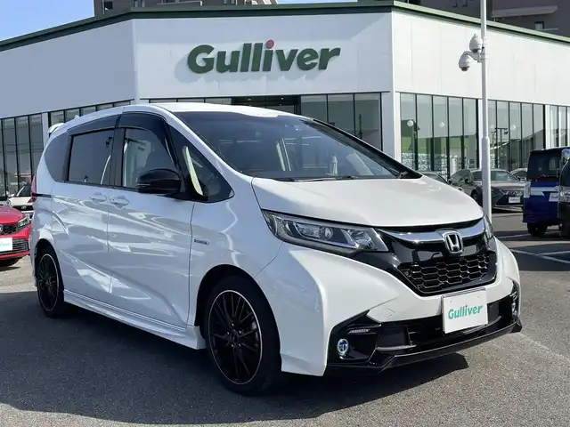 ホンダ フリード ハイブリット モデューロX ホンダセンシング 長崎県 2019(平31)年 6.6万km ホワイトオーキッドパール ワンオーナー/純正９型ナビ/（フルセグ・DVD・SD・BT・HDMI）/バックカメラ/ホンダセンシング/純正ドライブレコーダー/両側パワースライドドア/ハーフレザーシート/ETC/ステアリングスイッチ/レーンキープアシスト/LEDヘッドライト/オートライト/社外ツイーター/スペアキー