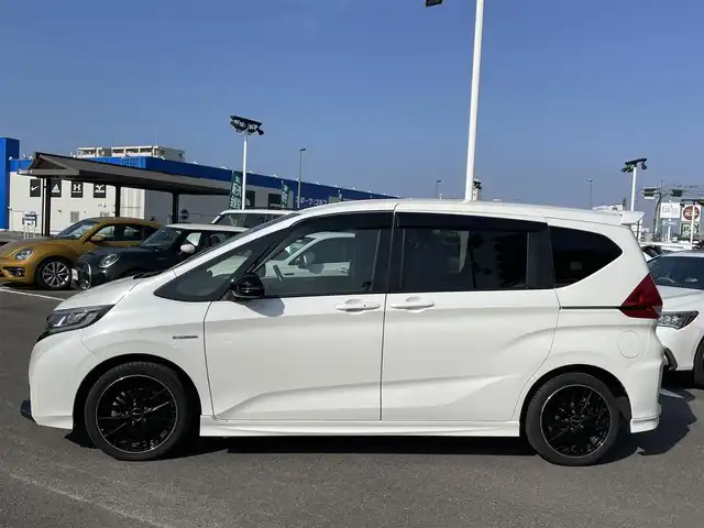 ホンダ フリード ハイブリット モデューロX ホンダセンシング 長崎県 2019(平31)年 6.6万km ホワイトオーキッドパール ワンオーナー/純正９型ナビ/（フルセグ・DVD・SD・BT・HDMI）/バックカメラ/ホンダセンシング/純正ドライブレコーダー/両側パワースライドドア/ハーフレザーシート/ETC/ステアリングスイッチ/レーンキープアシスト/LEDヘッドライト/オートライト/社外ツイーター/スペアキー