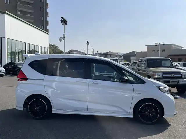 ホンダ フリード ハイブリット モデューロX ホンダセンシング 長崎県 2019(平31)年 6.6万km ホワイトオーキッドパール ワンオーナー/純正９型ナビ/（フルセグ・DVD・SD・BT・HDMI）/バックカメラ/ホンダセンシング/純正ドライブレコーダー/両側パワースライドドア/ハーフレザーシート/ETC/ステアリングスイッチ/レーンキープアシスト/LEDヘッドライト/オートライト/社外ツイーター/スペアキー