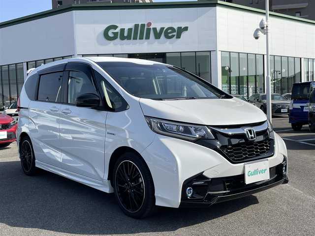 ホンダ フリード ハイブリット モデューロX ホンダセンシング 長崎県 2019(平31)年 6.6万km ホワイトオーキッドパール ワンオーナー/純正９型ナビ/（フルセグ・DVD・SD・BT・HDMI）/バックカメラ/ホンダセンシング/純正ドライブレコーダー/両側パワースライドドア/ハーフレザーシート/ETC/ステアリングスイッチ/レーンキープアシスト/LEDヘッドライト/オートライト/社外ツイーター/スペアキー