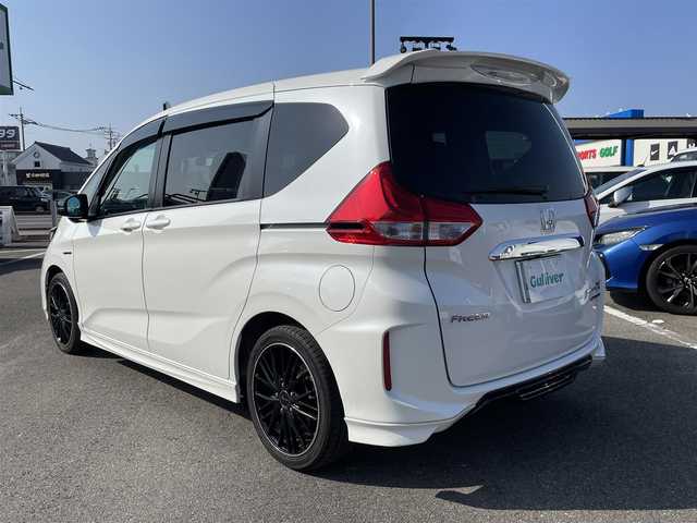 ホンダ フリード ハイブリット モデューロX ホンダセンシング 長崎県 2019(平31)年 6.6万km ホワイトオーキッドパール ワンオーナー/純正９型ナビ/（フルセグ・DVD・SD・BT・HDMI）/バックカメラ/ホンダセンシング/純正ドライブレコーダー/両側パワースライドドア/ハーフレザーシート/ETC/ステアリングスイッチ/レーンキープアシスト/LEDヘッドライト/オートライト/社外ツイーター/スペアキー