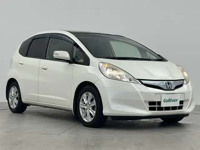 ホンダ フィット ハイブリット ナビ プレミアムセレクション 愛知県 2010(平22)年 11.7万km プレミアムホワイトパール 純正ナビ（ワンセグ、CD、DVD）/シートヒーター（D+N)/ETC/Bカメラ/純正アルミホイール/純正フロアマット/LEDヘッドライト/アイドリングストップ/オートライト/スマートキー/AAC