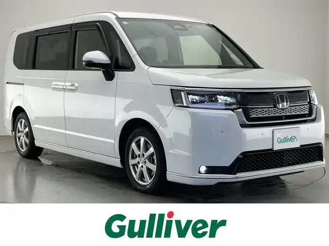 ホンダ ステップワゴン スパーダ eHEV プレミアムライン 愛知県 2024(令6)年 1.3万km プラチナホワイトパール 純正１１．４型ナビ　純正１５．６型後席モニター　デジタルインナーミラー　マルチビューカメラ　ＢＳＭ　電動リアゲート　ホンダセンシング　衝突軽減　追従クルコン　ハーフレザー　シートヒーター　ＬＥＤ　禁煙