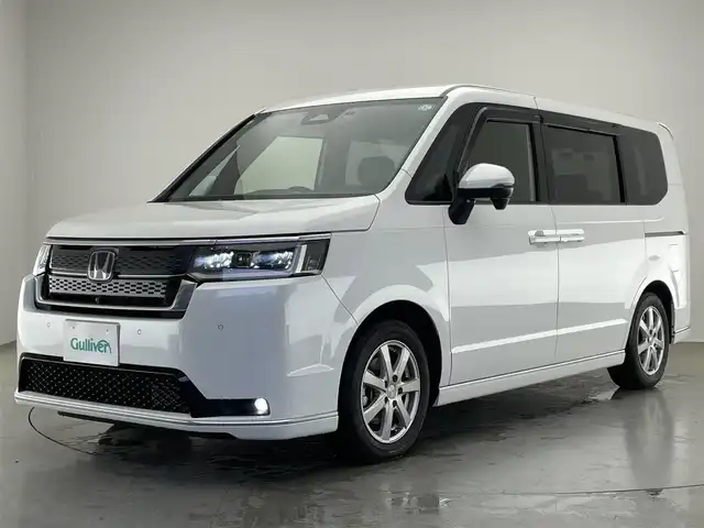 ホンダ ステップワゴン スパーダ eHEV プレミアムライン 愛知県 2024(令6)年 1.3万km プラチナホワイトパール 純正１１．４型ナビ　純正１５．６型後席モニター　デジタルインナーミラー　マルチビューカメラ　ＢＳＭ　電動リアゲート　ホンダセンシング　衝突軽減　追従クルコン　ハーフレザー　シートヒーター　ＬＥＤ　禁煙