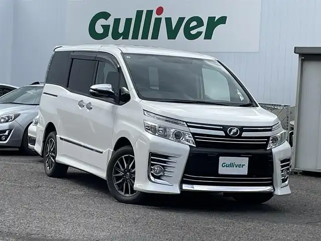 トヨタ ヴォクシー ZS 煌 福島県 2015(平27)年 10.9万km ホワイトパールクリスタルシャイン ４ＷＤ/純正ナビ/・ＣＤ/・ＤＶＤ/・フルセグＴＶ/・Ｂｌｕｅｔｏｏｔｈ/バックカメラ/フリップダウンモニター/両側パワースライドドア/ビルトインＥＴＣ/アイドリングストップ/ドアバイザー/プッシュスタート（スペアキー有）
