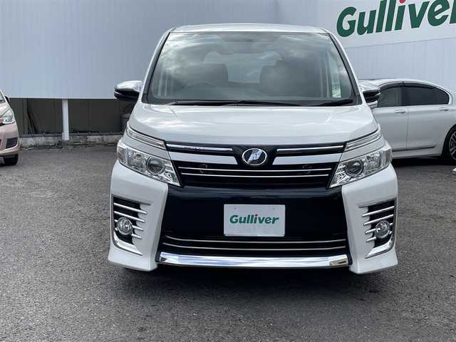 トヨタ ヴォクシー ZS 煌 福島県 2015(平27)年 10.9万km ホワイトパールクリスタルシャイン ４ＷＤ/純正ナビ/・ＣＤ/・ＤＶＤ/・フルセグＴＶ/・Ｂｌｕｅｔｏｏｔｈ/バックカメラ/フリップダウンモニター/両側パワースライドドア/ビルトインＥＴＣ/アイドリングストップ/ドアバイザー/プッシュスタート（スペアキー有）