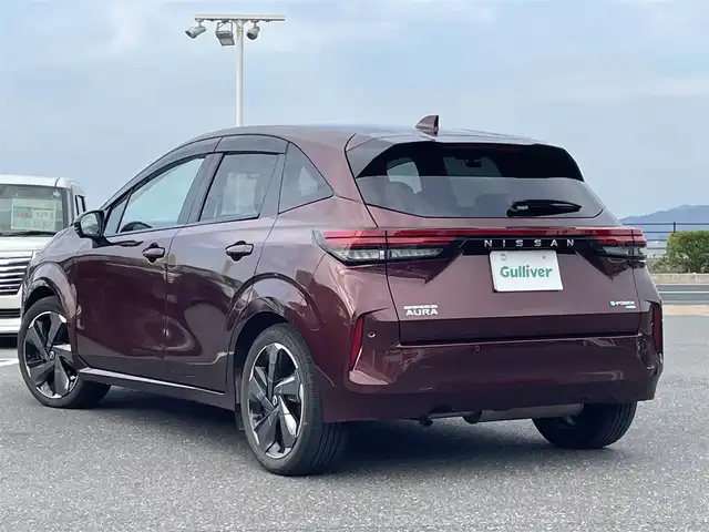 日産 オーラ G FOUR 島根県 2022(令4)年 3.4万km バーガンディー 登録時走行距離33479km/取扱説明書【車両/ナビ】/保証書/日産コネクト9インチナビ【Bluetooth/HDMI/アップルカープレイ/アンドロイドオート】/アラウンドビューモニター/プロパイロット/BOSEサウンドシステム/LEDヘッドライト/オートライト/前席シートヒーター/ステアリングヒーター/プッシュスタート/スマートキー(スペアスマート×1)/ハーフレザーシート/前後ドライブレコーダー/ビルトインETC/純正17インチAW