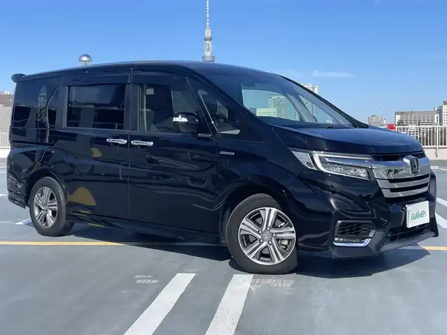 ホンダ ステップワゴン 東京都 2018(平30)年 5.4万km プレミアムスパークルブラックパール ワンオーナー/Gathers製ナビ（VXM-197VFNi)/(CD/DVD/BT/地デジTV/ミュージックラック）/バックカメラ/両側パワースライドドア/純正１６インチアルミ/LEDヘッドライト/ビルトインETC/シートヒーター/ヒーテッドミラー/社外ドライブレコーダー/純正マット・バイザー/Honda SENSING/衝突軽減ブレーキ/誤発進抑制機能/路外逸脱抑制機能/先行車発進お知らせ機能/保証書・取説