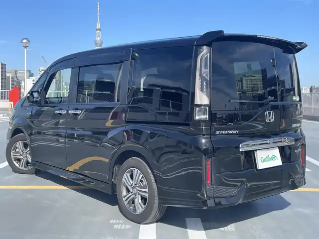 ホンダ ステップワゴン 東京都 2018(平30)年 5.4万km プレミアムスパークルブラックパール ワンオーナー/Gathers製ナビ（VXM-197VFNi)/(CD/DVD/BT/地デジTV/ミュージックラック）/バックカメラ/両側パワースライドドア/純正１６インチアルミ/LEDヘッドライト/ビルトインETC/シートヒーター/ヒーテッドミラー/社外ドライブレコーダー/純正マット・バイザー/Honda SENSING/衝突軽減ブレーキ/誤発進抑制機能/路外逸脱抑制機能/先行車発進お知らせ機能/保証書・取説