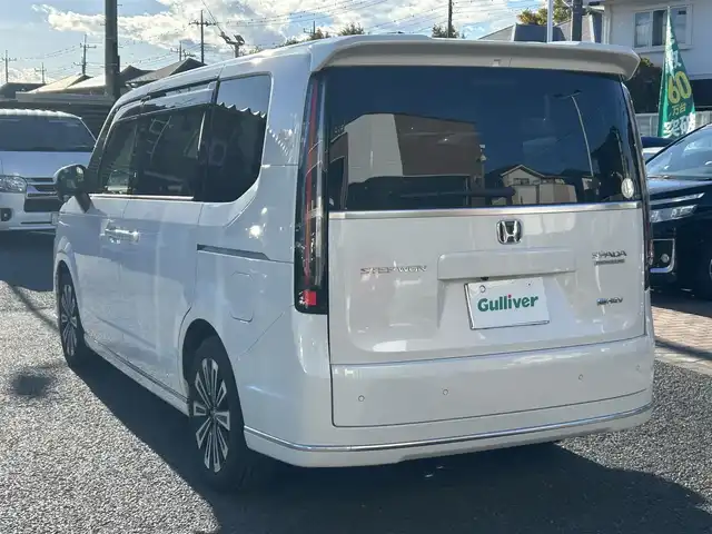ホンダ ステップワゴン スパーダ eHEV プレミアムライン 埼玉県 2025(令7)年 1.2万km プラチナホワイトパール 純正ナビ（Ｂｌｕｅｔｏｏｔｈ、ＣＤ、ＤＶＤ、フルセグＴＶ）/全方位カメラ/ビルトインＥＴＣ/前後ドラレコ/ＵＳＢ入力端子/シートヒーター（二列目まで）/両側パワスラ/クリアランスソナー/電動リアゲート/追従走行有クルコン/スペアキー1本/ワンオーナー/保証書/取扱説明書/ナビ取扱説明書/純正フロアマット/ハーフレザーシート/純正アルミホイール/LEDヘッドライト