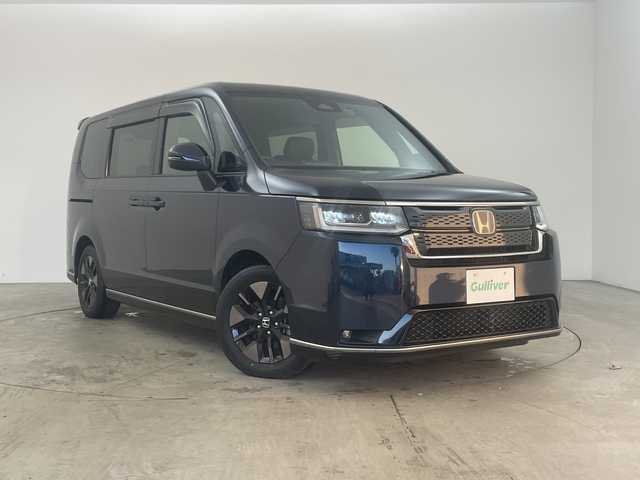 ホンダ ステップワゴン スパーダ eHEV 兵庫県 2022(令4)年 5.9万km ミッドナイトブルービームM ・純正１１．４インチナビ（LXM-237VFLi）/CD/DVD/Bluetooth/SD/USB/TV/Apple CarPlay/Android Auto/・バックカメラ/・ビルトインETC/・Honda　SENSING/・衝突軽減ブレーキ/・誤発進抑制機能/・後方誤発進抑制機能/・近距離衝突軽減ブレーキ/・歩行者事故低減ステアリング/・路外逸脱抑制機能/・アダプティブクルーズコントロール/・車線維持支援システム/・トラフィックジャムアシスト/・先行車発進お知らせ機能/・標識認識機能/・オートハイビーム/・アダプティブドライビングビーム/・ブラインドスポットインフォメーション/・両側パワースライドドア/・パワーテールゲート(メモリー機能付)/・ハーフレザー/・前席シートヒーター/・パドルシフト/・ＬＥＤヘッドライト/・ＬＥＤフォグランプ/・前後ドライブレコーダー/・スマートキー