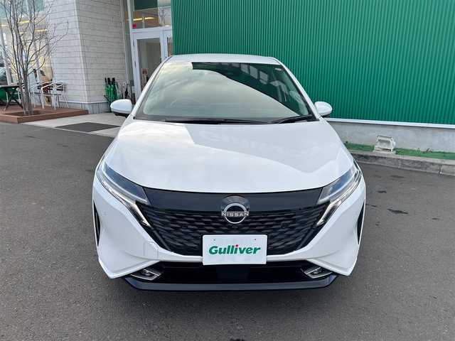 日産 オーラ G レザーエディション 宮城県 2023(令5)年 0.1万km ピュアホワイトパール 純正9インチナビ/(フルセグTV/SD/BT/USB/AUX)/アラウンドビューモニター/エマージェンシーブレーキ/衝突軽減サポート/レーンキープアシスト/ブラインドスポットモニター/パーキングセンサー/後退時車両検知警報/標識認識支援/ふらつき防止/インテリジェントルームミラー/革巻きステアリング/ステアリングスイッチ/レザーシート/コーナーセンサー/アイドリングストップ/オートエアコン/オートライト/オートマチックハイビーム/オートホールド/ドライブセレクトモード/プッシュスタート＆スマートキ/ウインカー付き電動格納ミラー/LEDヘッドライト/フォグランプ/純正フロアマット/純正17インチAW