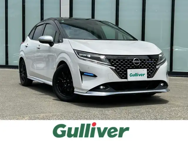 日産 ノート オーテック 大阪府 2021(令3)年 1.6万km ピュアホワイトパール / スーパーブラック 2トーン 純正９インチナビ/   フルセグTV/Bluetooth/USB/全方位モニター/衝突軽減ブレーキ/横滑り防止装置/コーナーセンサー/プロパイロット/ＢＳＭ/社外エアロ/スマートルームミラー/前席シートヒーター/ワイヤレス充電/100V電源/ドライブレコーダー/純正16インチアルミホイール/レザーシート/純正フロアマット/プッシュスタート/スマートキー/ＥＴＣ/ＬＥＤ