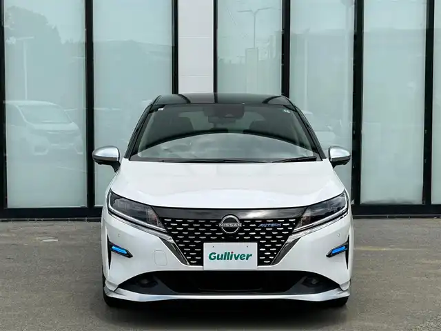 日産 ノート オーテック 大阪府 2021(令3)年 1.6万km ピュアホワイトパール / スーパーブラック 2トーン 純正９インチナビ/   フルセグTV/Bluetooth/USB/全方位モニター/衝突軽減ブレーキ/横滑り防止装置/コーナーセンサー/プロパイロット/ＢＳＭ/社外エアロ/スマートルームミラー/前席シートヒーター/ワイヤレス充電/100V電源/ドライブレコーダー/純正16インチアルミホイール/レザーシート/純正フロアマット/プッシュスタート/スマートキー/ＥＴＣ/ＬＥＤ