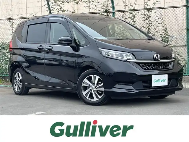 ホンダ フリード＋ G ホンダセンシング 東京都 2022(令4)年 6万km クリスタルブラックパール 純正Gathersナビ/バックカメラ/ETC/アダプティブクルーズコントロール/スマートキー/スペアキー/前後ドライブレコーダー/純正フロアマット/ハーフレザーシート/シートヒーター/両側パワースライドドア/純正15インチアルミホイール/後ろコーナーセンサー/純正LEDヘッドライト/Bluetooth/フルセグテレビ/MSV/USB入力端子