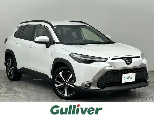 トヨタ カローラ クロス ハイブリッド Z 道央・札幌 2024(令6)年 1.9万km プラチナホワイトパールマイカ ・4WD/・寒冷地仕様/・トヨタセーフティセンス/・衝突被害軽減ブレーキ/・レーンキープアシスト/・レーダークルーズコントロール/・標識認識システム/・純正ディスプレイオーディオ/・ナビ機能/フルセグTV/Bluetooth/・バックカメラ/・ビルトインETC/・シートヒーター/・ステアリングヒーター/・パワーバックドア/・ドアロック連動ミラー/・オートブレーキホールド/・プッシュスタート/・スマートキー/・横滑り防止装置