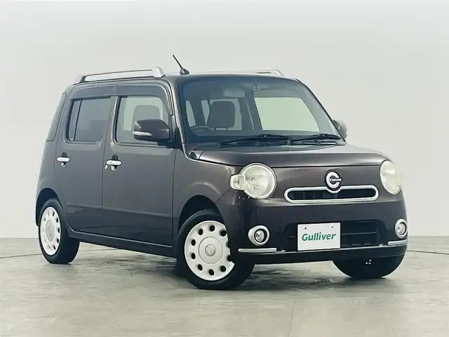 ダイハツ ミラ ココア プラスX スペシャルコーデ 福島県 2014(平26)年 5.5万km プラムブラウンクリスタルマイカ 社外SDナビ/型番:CN-RA04D/・AM/FM/CD/DVD/BT/フルセグTV/・バックカメラ/・ETC/・前方ドライブレコーダー/ルーフレール/スマートキー/革巻きステアリング/・チルト式ステアリング/電動格納ドアバイザー/ドアバイザー/純正フロアマット