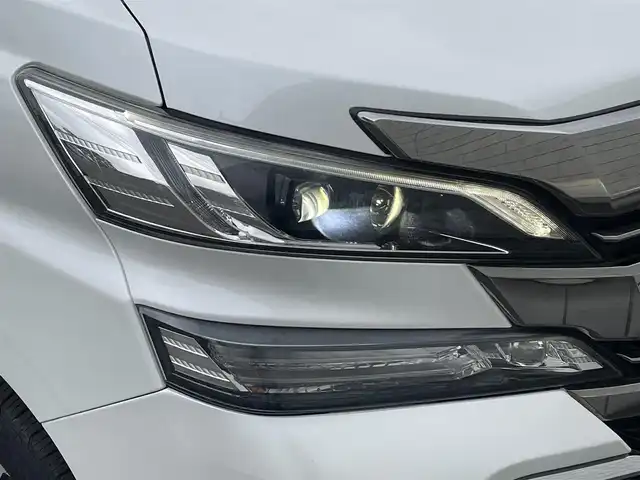 トヨタ ヴェルファイア ハイブリット ZR Gエディション 岩手県 2015(平27)年 7.5万km ホワイトパールクリスタルシャイン ・４WD/・純正ナビ フルセグTV　BT　DVD/・ムーンルーフ/・レザーシート/・モデリスタエアロ/・純正フリップダウンモニター/・JBLサウンド/・両側パワースライドドア/・バックカメラ/・パワーバックドア/・レーダークルーズコントロール/・ステアリングヒーター/・前席シートヒーター/・オートハイビーム/・ECOモード/・EVモード/・ナノイー/・ビルトインETC/・保証書/・取扱説明書/・スペアキー