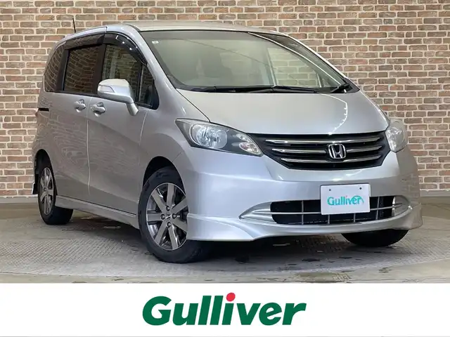 ホンダ フリード Giエアロ 岩手県 2009(平21)年 14万km アラバスターシルバーメタリック 両側パワースライドドア/バックカメラ/純正ナビ（Bluetooth CD DVD フルセグ）/横滑り防止装置/オートエアコン/オートライト/熱線入りフロントウインドウ/HIDヘッドライト/純正１５インチアルミホイール/ETC/ドアミラーウインカー/ドアバイザー/スペアキー/３列シート/ウォークスルー