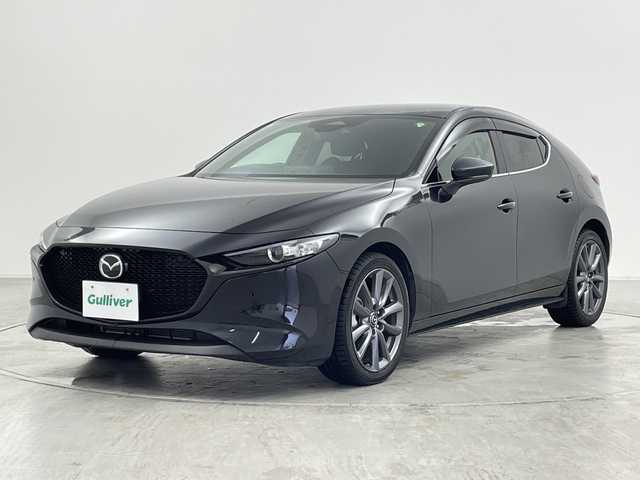 マツダ マツダ３ファストバック 15S ツーリング 群馬県 2023(令5)年 1.6万km ジェットブラックマイカ 純正１０．２５型ナビ　全周囲カメラ　衝突被害軽減ブレーキ　ブラインドスポットモニター　アダプティブクルーズコントロール　前後ドライブレコーダー　ETC 置くだけ充電器　LED オートハイビーム　禁煙車